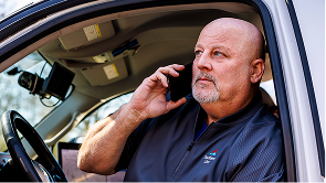 Utility worker on mobile device